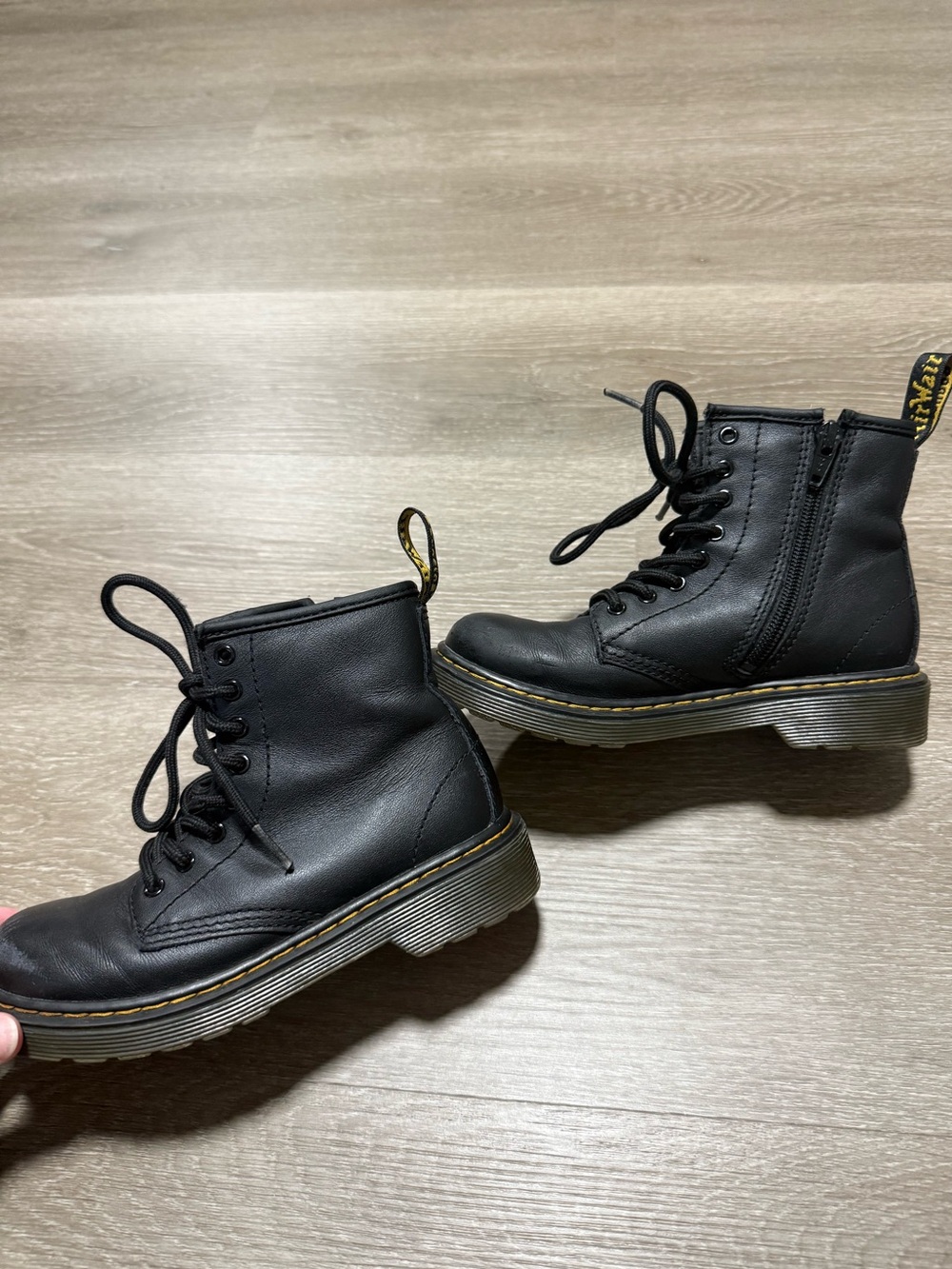 Kids Dr. Martens 1460 Junior boots featuring a distinct side zipper for easy on